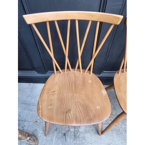 1115 - A set of four mid-century Ercol 'Candlestick' dining chairs.