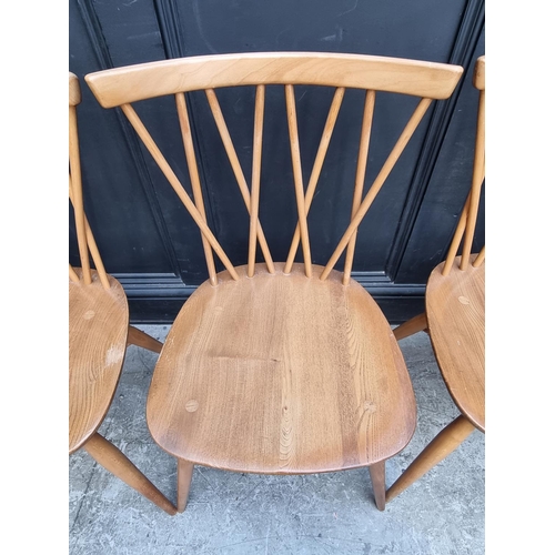 1115 - A set of four mid-century Ercol 'Candlestick' dining chairs.