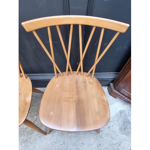 1115 - A set of four mid-century Ercol 'Candlestick' dining chairs.