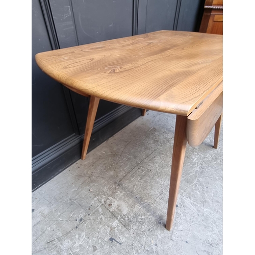 1116 - A mid-century Ercol Windsor drop leaf dining table, 113cm wide.