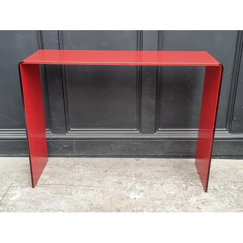 1121 - An Italian red glass console table, 101cm wide.