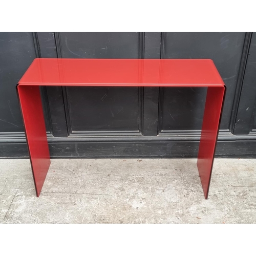 1121 - An Italian red glass console table, 101cm wide.