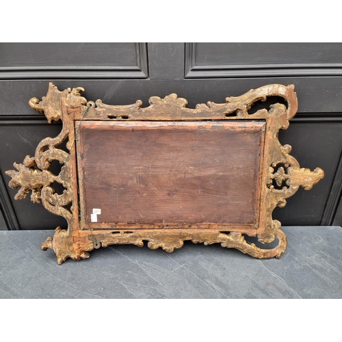 1124 - An 18th century carved giltwood framed wall mirror, 69 x 49cm.