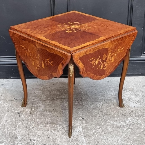 1127 - An Italian marquetry low drop leaf occasional table, with brass mounts, 105cm wide when open.... 