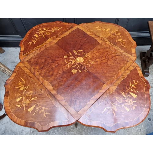 1127 - An Italian marquetry low drop leaf occasional table, with brass mounts, 105cm wide when open.... 