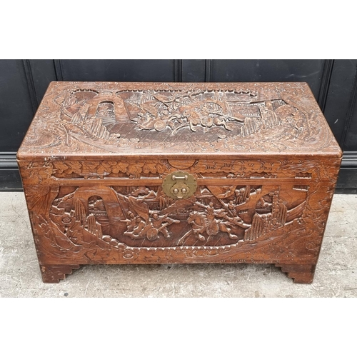 1129 - A Chinese carved camphor wood coffer, 101cm wide.