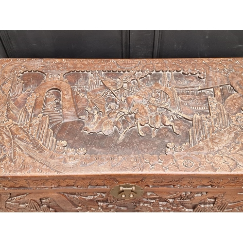 1129 - A Chinese carved camphor wood coffer, 101cm wide.