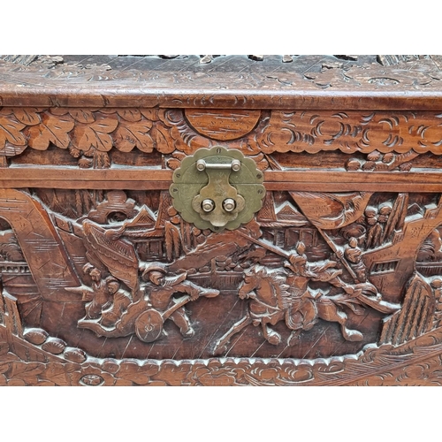 1129 - A Chinese carved camphor wood coffer, 101cm wide.