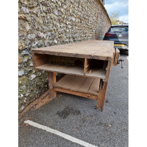 1136 - A very large vintage pine woodworking bench, 337cm long.