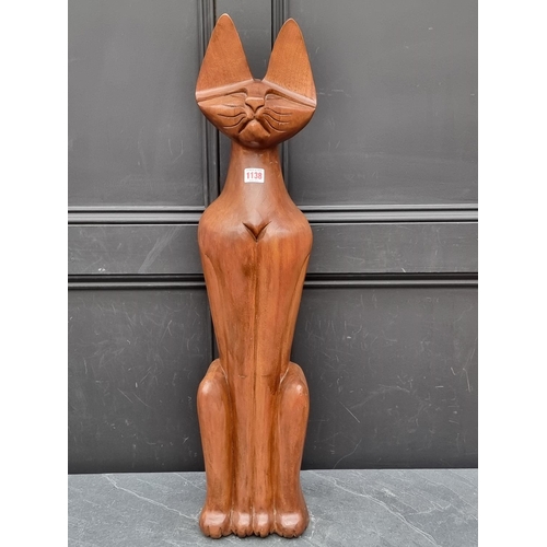 1138 - A large carved walnut seated cat, 83cm high.