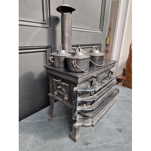 1140 - A scarce 19th century French cast iron miniature stove, inscribed 'Dupont, Fallon', the top 37c... 