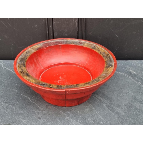 1150 - A Chinese red stained staved wood bowl, with gilt decoration, 31.5cm diameter.