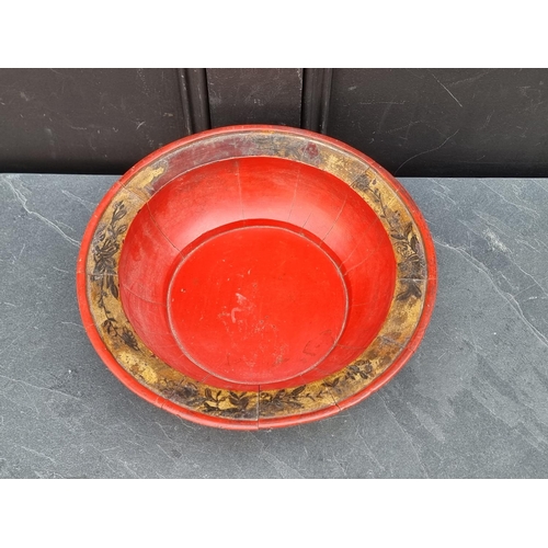 1150 - A Chinese red stained staved wood bowl, with gilt decoration, 31.5cm diameter.