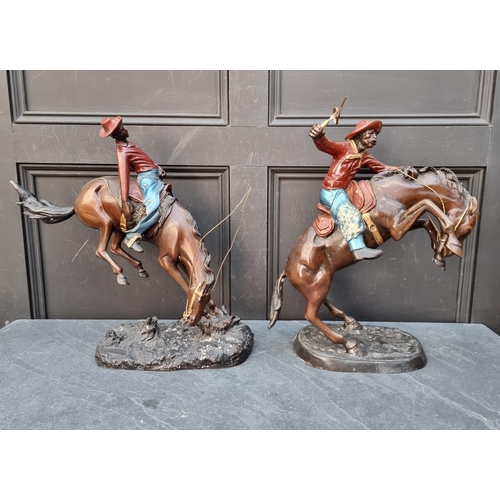 1178 - After Frederic Remmington, a pair of bronze cowboys, largest 51cm high. (2)