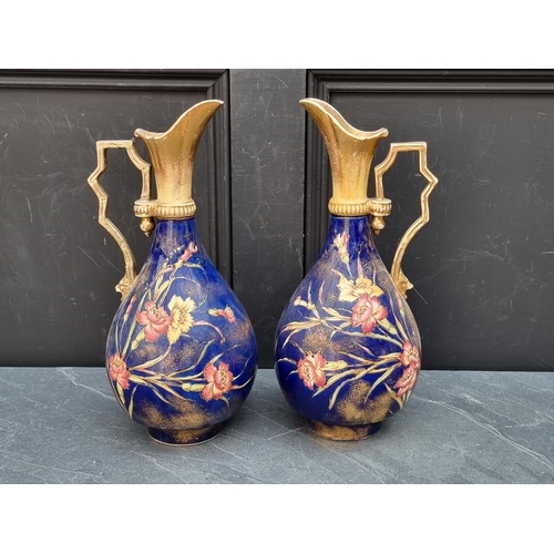 1180 - A pair of antique pottery ewers, 37cm high.