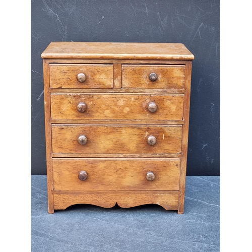 1181 - A miniature antique mahogany chest of drawers, 27.5 high x 23.5cm wide.