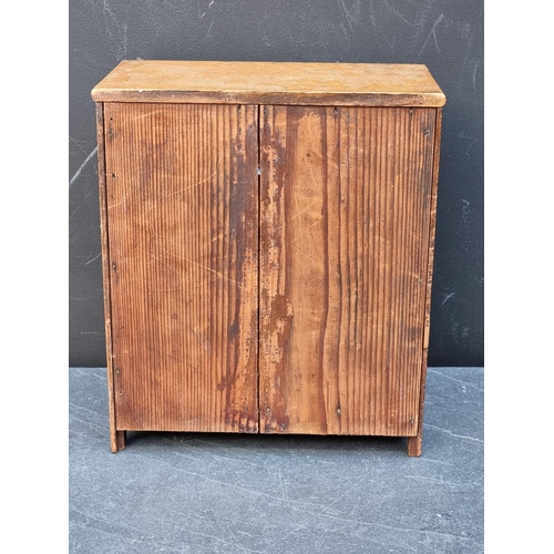 1181 - A miniature antique mahogany chest of drawers, 27.5 high x 23.5cm wide.