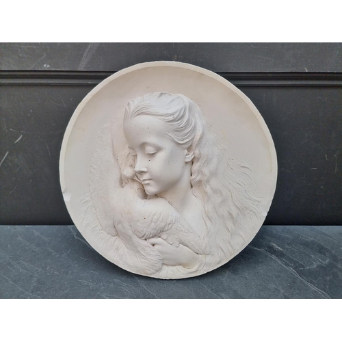 1182 - A plaster relief plaque of a girl with a bird, 44cm diameter, (chips).