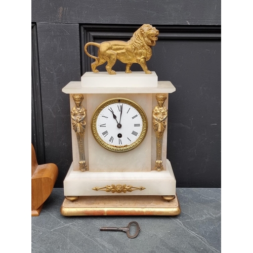 1194 - An onyx and gilt metal mantel clock, 39cm high; together with a 1940s walnut mantel timepiece. ... 