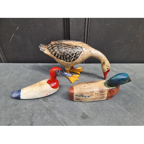 1201 - Two painted wood decoy ducks; and another standing composition example. (3)