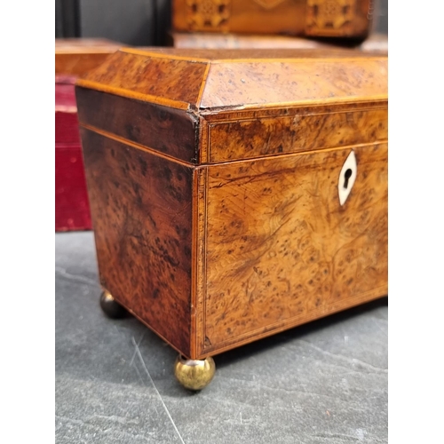 1204 - A George III burr yew and line inlaid tea caddy, with bone escutcheon, 18cm wide; together with four... 