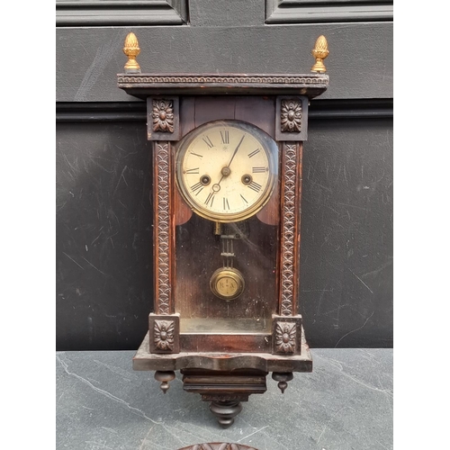 1207 - A small antique Continental musical wall clock, 42cm high; together with a carved walnut aneroid bar... 