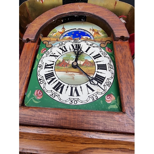 1210 - Two Dutch brass mounted wall clocks; together with another continental brass wall clock, with painte... 