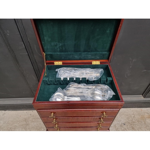 1217 - A collection electroplated cutlery, in mahogany four drawer chest, 44.5cm wide.... 