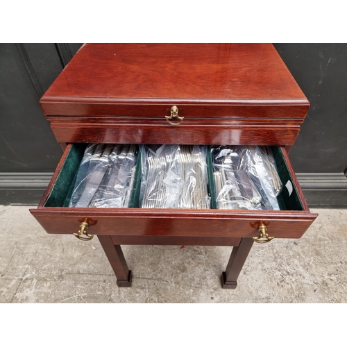 1217 - A collection electroplated cutlery, in mahogany four drawer chest, 44.5cm wide.... 