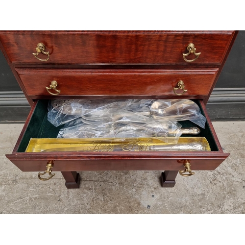 1217 - A collection electroplated cutlery, in mahogany four drawer chest, 44.5cm wide.... 