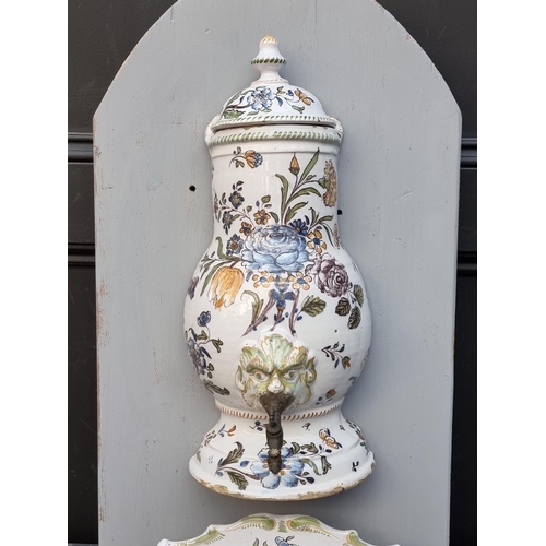 1218 - An antique French tin glazed pottery fountain, the body and cover 43cm high, (cover and bowl associa... 