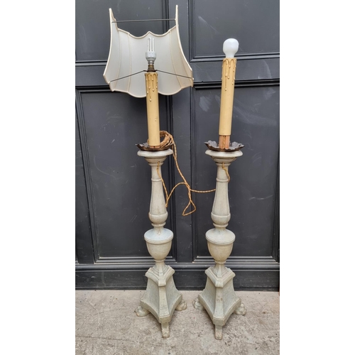 1228 - A pair of green painted and parcel gilt floor lamps, total height 125cm.