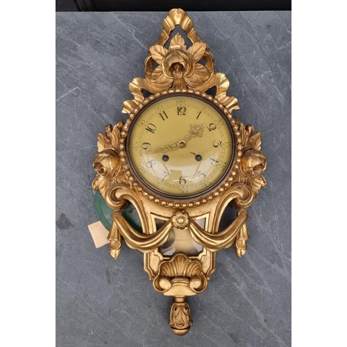 1236 - A giltwood wall clock, with painted dial, 54cm high, with pendulum.