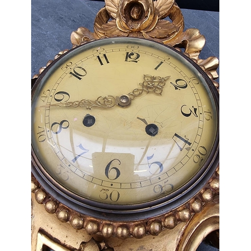 1236 - A giltwood wall clock, with painted dial, 54cm high, with pendulum.