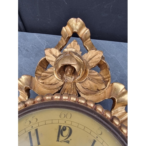 1236 - A giltwood wall clock, with painted dial, 54cm high, with pendulum.