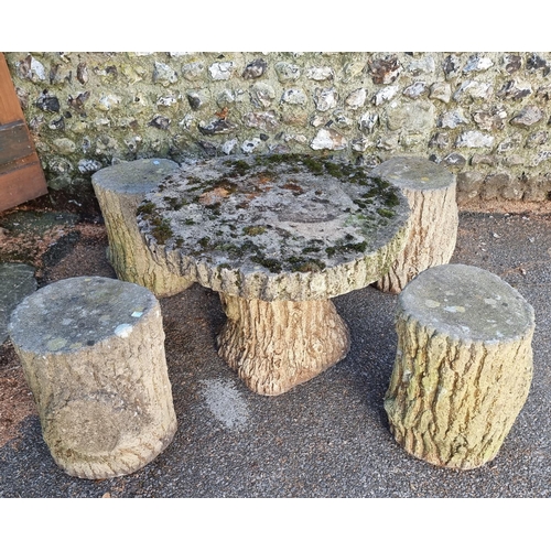 1238 - A composition stone garden table and four stools, each of naturalistic trunk form, the table 78... 