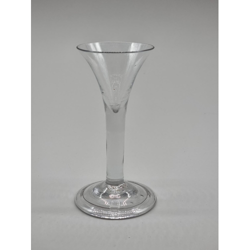 1245 - Two 18th century plain stemmed glasses, 12cm and 14cm high. (2)