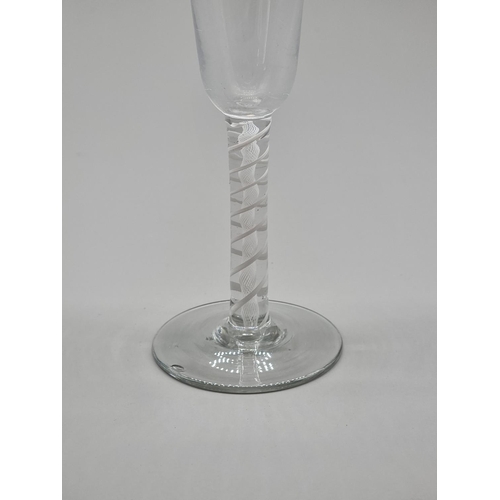 1249 - An 18th century double series opaque twist ale glass, 19.5cm high.