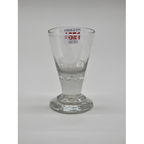 1251 - An 18th century Continental drinking glass, with engraved decoration, 10.5cm high.