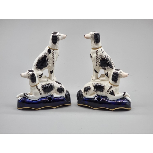 1253 - A pair of Victoria Staffordshire dog ink wells, 15.5cm high.