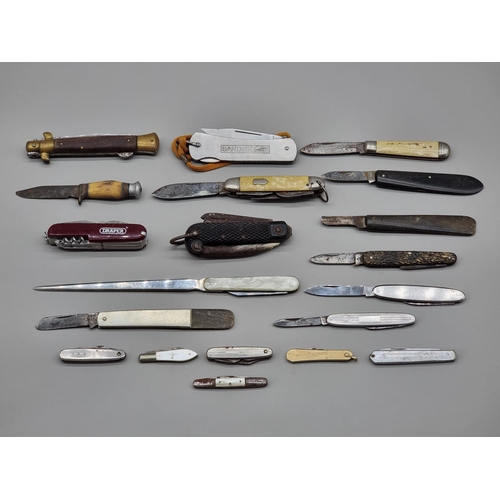 1258 - A collection of vintage penknives, to include a small silver bladed example.