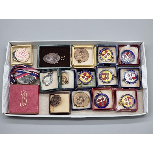 1265 - A small group of sporting medals, to include a 1982 London Marathon example, and other enamel mounte... 