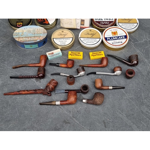 1266 - A collection briarwood pipes and various tobacco.