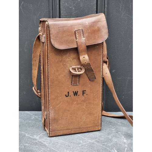 1310 - A vintage tan leather shoulder bag, stamped 'Finnigans, 18 New Bond St...', with partially fitted in... 