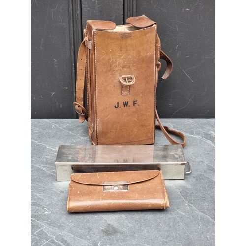 1310 - A vintage tan leather shoulder bag, stamped 'Finnigans, 18 New Bond St...', with partially fitted in... 