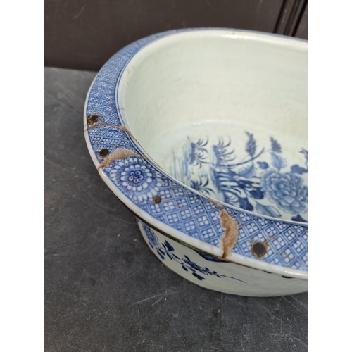 1347 - A late 18th century Chinese blue and white bidet, 60.5cm long, (repaired).