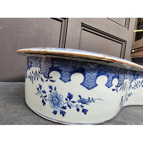 1347 - A late 18th century Chinese blue and white bidet, 60.5cm long, (repaired).