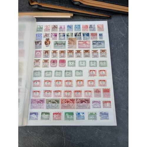 1350 - Stamps: three albums and two stockbooks. (5)