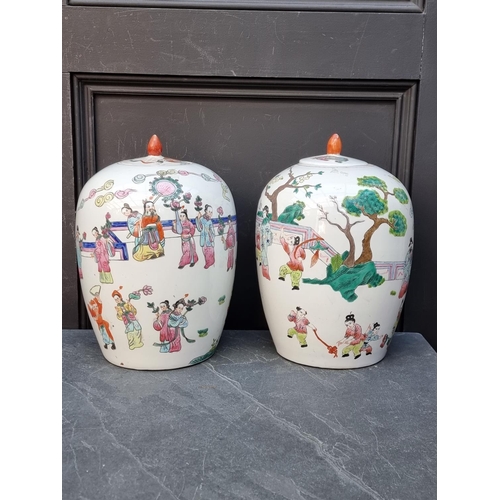 1373 - A pair of Chinese famille rose ovoid jars and covers, 31.5cm high.