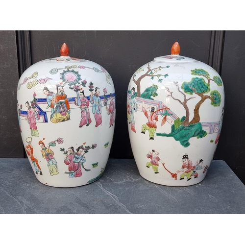 1373 - A pair of Chinese famille rose ovoid jars and covers, 31.5cm high.